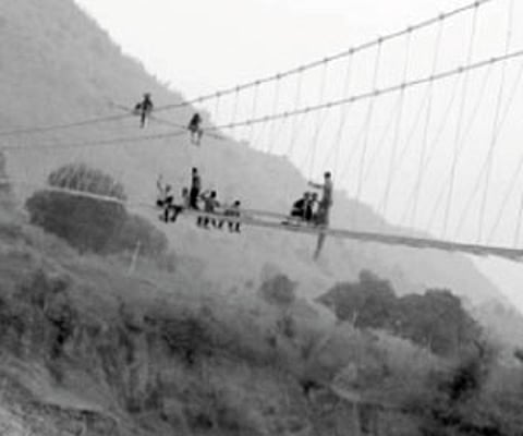 The suspension bridge under construction near Chakkaguda village, on the outskirts of Rayagada town I Express Photo