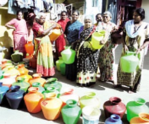 (Left) Empty pots lined up for water. (Right) Garbage dumped near a transformer | SURESH NAMPOOTHIRI