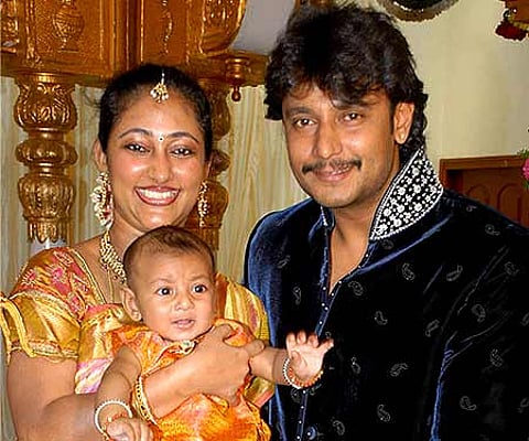 File photo of Darshan with wife and son