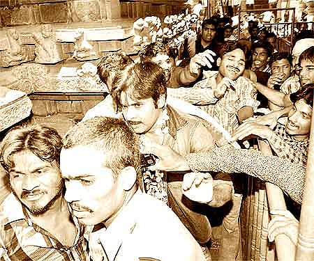 Cine actor Pawan Kalyan being whisked away by personal security guards| Express Photo.