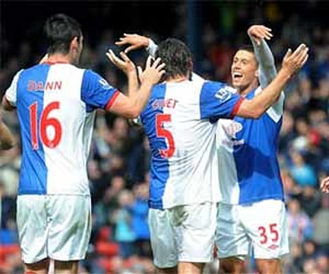 Blackburn Rovers' Scott Dann, Gael Givet and Jason Lowe celebrate their 4-3 victory. AP
