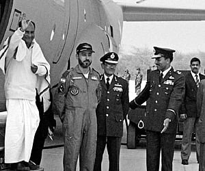 Defence Minister A K Antony alighting from a Lockheed Martin C-130J Super Hercules aircraft during the ceremony for its induction. (EPS)