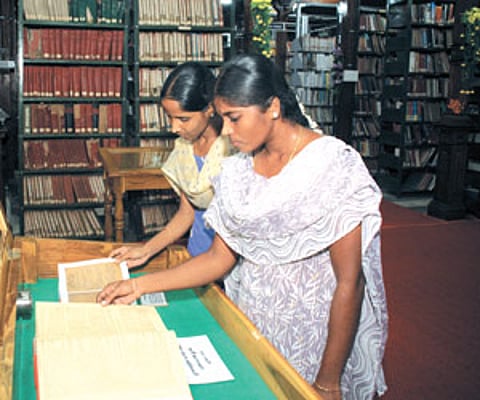 Visitors glance through rare books put on display at Connemara Public Library