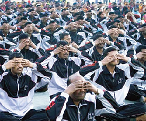 soldiers practicing yoga at a camp