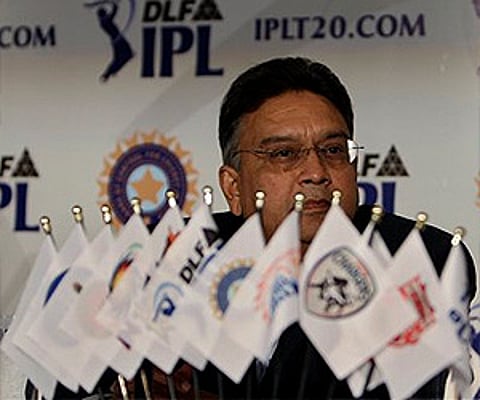 IPL Chairman, Chirayu Amin is partially obscured by the 10 teams' pennants, along with those of IPL and BCCI. (Photo: AP)