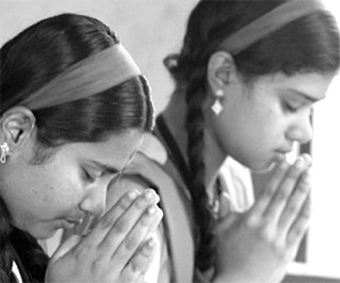 Students immersed in prayer at Cotton Hill Girls Higher Secondary School prior to the SSLC exams, which began on Monday - Express