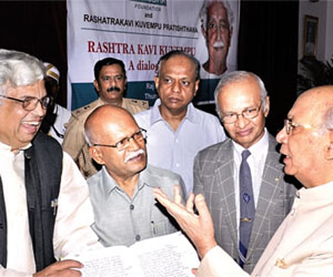 H R Bharadwaj, governor of Karnataka (right) in conversation with Professor Radhakrishna (left), Professor Hampa Nagarajaiah, Professor Manu Chakarvar