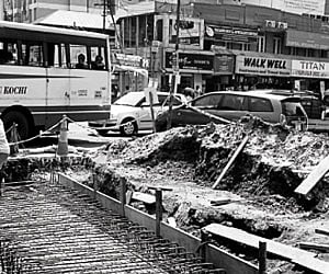 Traffic moving at a snail’s pace, along a single lane, at the Kottakkal Arya Vaidya Sala Junction where drainage work has been going on.