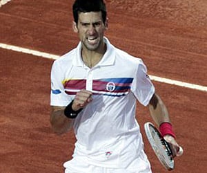 Serbia's Novak Djokovic reacts after winning a point against Spain's Rafael Nadal in the Italian Open tennis tournament in Rome. (AP Photo)