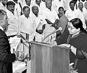 Chief Minister J Jayalalithaa signs a document after taking oath | AS Ganesh / P Jawahar