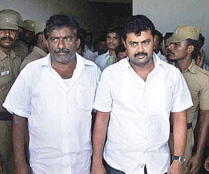R Murugesan, husband of former DMK secretary Vasuki Murugesan, and her brother and youth wing organiser V S K Ravikumar being taken into custody. EPS
