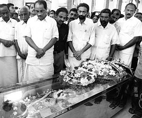 Excise Minister K Babu paying homage to Fr Paul Kariyatty at St George Basilica in Angamaly