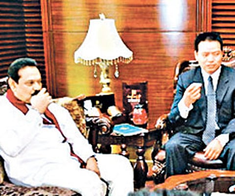 Chinese women wearing saree serving tea to the visiting Sri Lankan President Mahinda Rajapaksa and others at the Foreign Studies University in Beijing