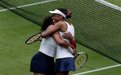 Williams sisters defend Olympic doubles gold