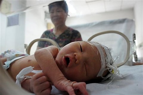 Chinese baby found in sewer pipe leaves hospital