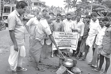 Residents take to the streets seeking road work