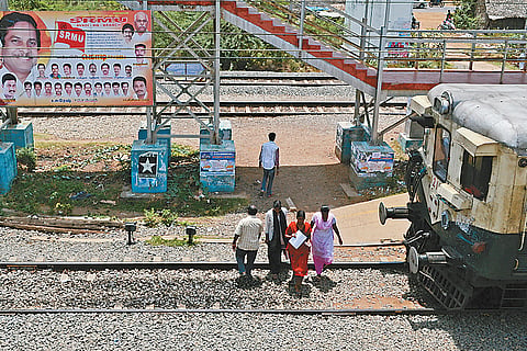 Commuters seek foot over bridge at Hindu College railway station