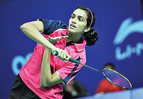 Saina steamrolls, Sindhu struggles