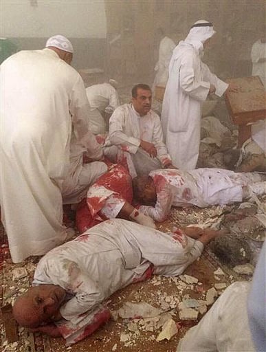 This image provided by Kuwaitna news shows injured people in the immediate aftermath of a deadly blast at a Shiite mosque in Kuwait City, Friday | AP