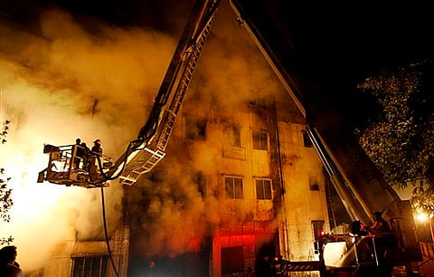 Bangladeshi firefighters battle a fire at Tazreen garment factory in Savar, on the outskirts of Dhaka, Bangladesh. |File Photo: AP