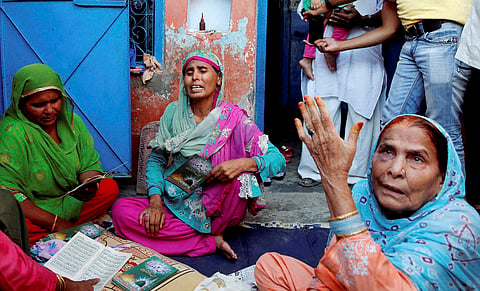 Relatives mourn the death of farmer Mohammad Akhlaq at his home in Bisara village about 45 kilometers 25 miles from New Delhi