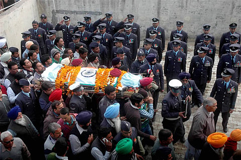 Soldiers carry the mortal remains of Commando CPL Gursewak Singh who was killed in Pathankot militants attacks during his funeral at his native place in Ambala on Monday.