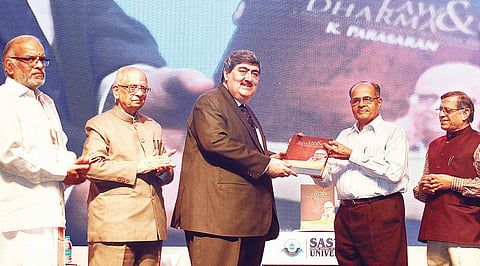 Chief Justice of the Madras High Court Sanjay Kishan Kaul presenting the first copy of ‘Law & Dharma’ to Prof N R Madhava Menon, Chancellor of Central University of Chhattisgarh, in the city on Sunday