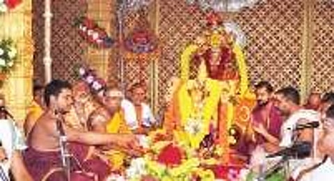 Priests performing pooja to the goddess Kanaka Durga on the first day of Dasara festival at Kanaka Durga temple atop Indrakeeladri hill in Vijayawada on Saturday.