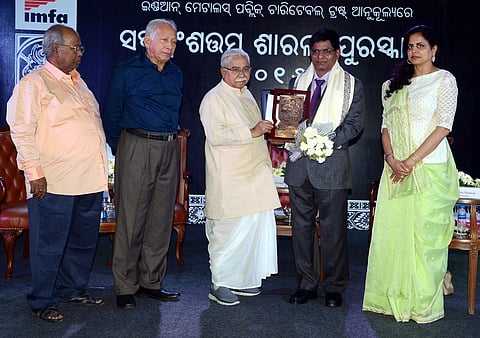 Sarala Puraskar being conferred on poet Hrushikesh mallick on Wednesday | Express