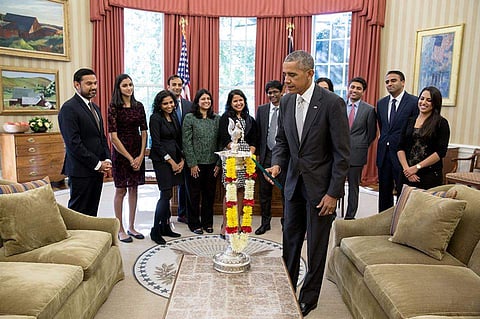 US President Barack Obama celebrated Diwali by lighting the first-ever diya in the Oval Office of the White House. |Facebook page of The White House