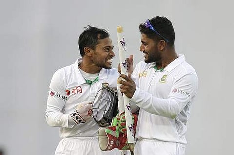 Bangladesh's captain Mushfiqur Rahim, left, celebrates with his teammate Imrul Kayes after their victory over England in the second cricket test match in Dhaka. | AP