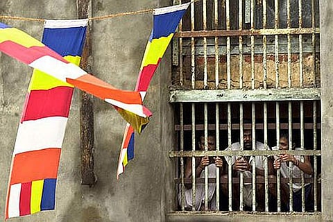 Prisoners peeping out of their cell (Photo: The Republic Square)