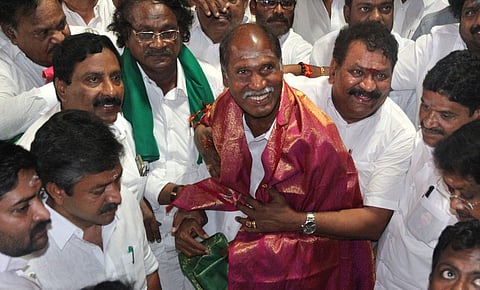 Om Sakthi Sekar, the AIADMK candidate from Nellitope constituency greets AINRC supremo Ranagasamy along with other AIADMK leaders in Puducherry on Wednesday Express photo | G PATTABIRAMAN