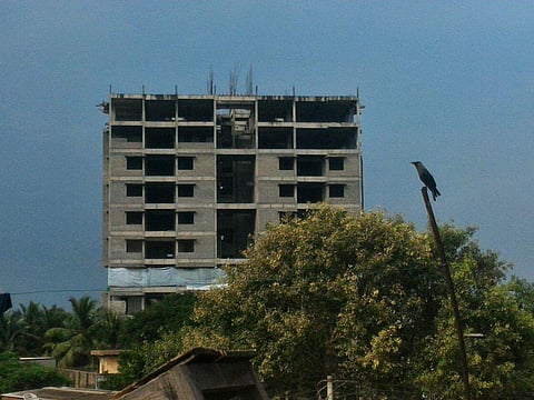 The 11-storey twin of the ill-fated under-construction residential tower in Moulivakkam in wait for the remote push for the complete demolition. | (Jawahar/EPS)