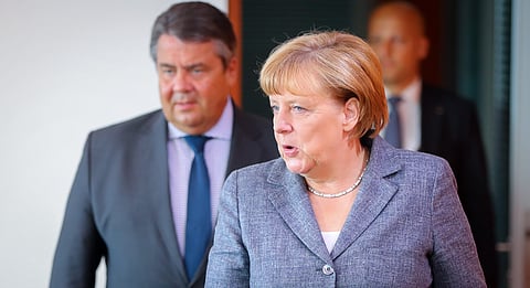 German Chancellor Angela Merkel , right, arrives at the Chancellery for a cabinet meeting in Berlin. (File Photo | AP)