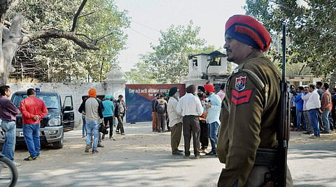 Security personnel and media representatives outside the Nabha jail in Punjab which was stormed by armed men who helped six terrorists escape, on Sunday | PTI