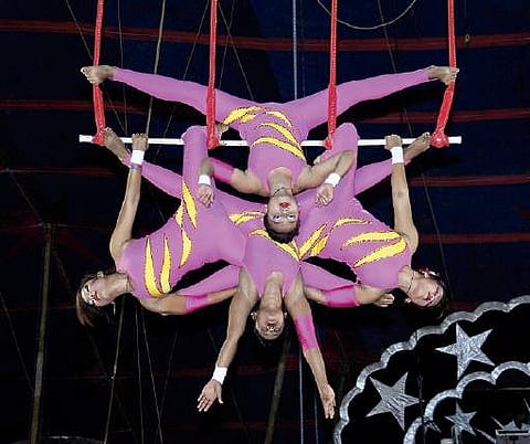 Girls performing acrobatics during the first show of Bombay Circus which started at Moosapet in Hyderabad on Wednesday | sathya keerthi