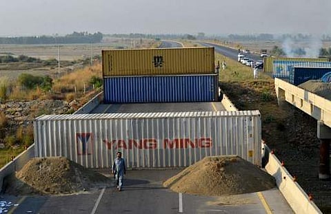 Containers set up by the police as a roadblock on the motorway in Swabi district in Pakistan. (File photo | AFP)