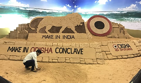 Artist Sudarsan Pattnaik creating a sand sculpture on Make in India Conclave at Janata Maidan on Tuesday | Express