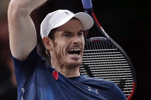 Britain's Andy Murray returns the ball to Tomas Berdych of Czech Republic during the quarterfinal match of the Paris Masters tennis tournament at the Bercy Arena. | AP