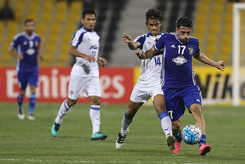 Bengaluru FC (in white) and Iraq Air Force Club (in Blue) players vie for the ball. (AFP)