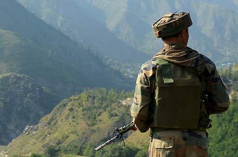 An Indian army soldier looks towards the site of a gunbattle between Indian army soldiers and rebels inside an army brigade headquarters near the border with Pakistan | (File Photo/AFP)