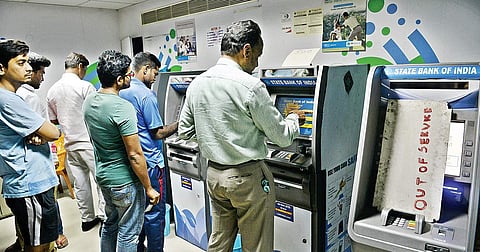 People stand in long queues to withdraw money from ATMs at Raj Bhavan Road in Hyderabad on Tuesday after the announcement by Prime Minister Narendra Modi about demonetisation of `500 and `1000 notes|
