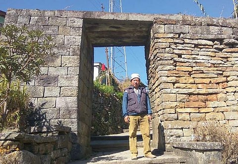 Methahetho Chase at the gate of Khonoma village in Nagaland