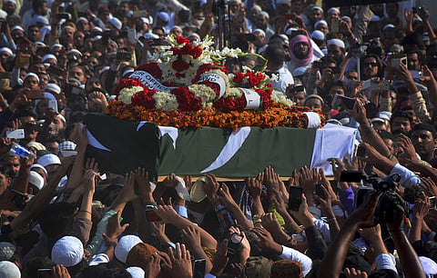 People carry the coffin of Junaid Jamshed, a popular pop singer turned Islamic preacher, during his funeral in Karachi, Pakistan, Thursday, Dec. 15, 2016. | AP