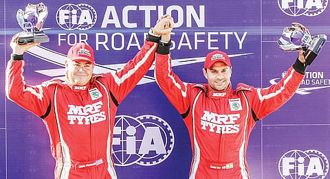 Gaurav Gill (right) and co-driver Glenn MacNeall with FIA APRC trophies