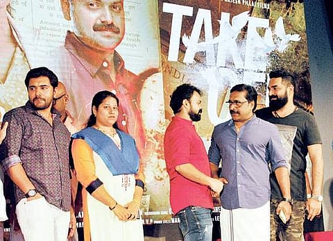 Actors Nivin Pauly, Kunchacko Boban, Renji Panicker and composer Gopi Sundar with the late director Rajesh Pillai's wife Mekha Pillai at the function to launch the title of Mahesh Narayanan's debut m