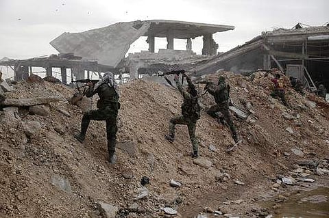 Syrian army soldiers fire their weapons. (Photo | AP)