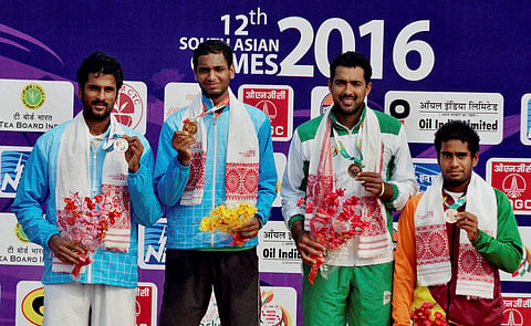 Silver medal winner from India Saketh Myneni gold medal winner from India Ramkumar Ramanathan bronze medal winners from Pakistan AUH Qureshi and from Sri Lanka S.Dissanayake displaying their medals after the singles tennis event at the 12th South Asian G