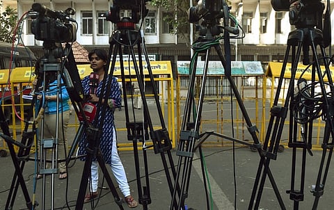 A TV journalist reports from outside the sessions court in Mumbai where David Headley's testimony is being recorded for the last three days. I AFP